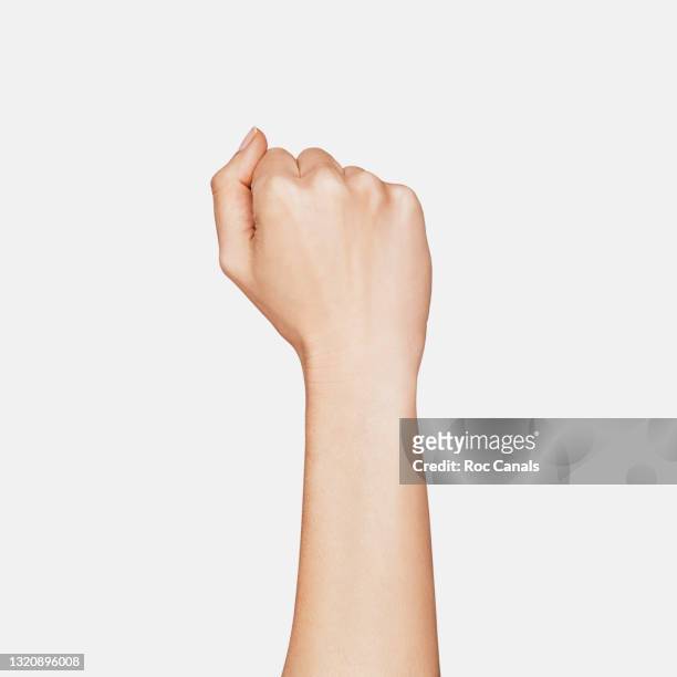 fist - human arm stock pictures, royalty-free photos & images