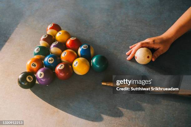 cropped hand arranging pool balls at snooker table - snooker and pool stock pictures, royalty-free photos & images