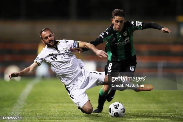 Ivan Franjic of the Bulls is challenged by Lachlan Wales of United during the A-League match between Western United and Macarthur FC at Leichhardt...