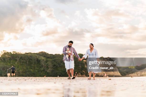 beach , a good place for enjoyment for family. - new zealand culture stock pictures, royalty-free photos & images