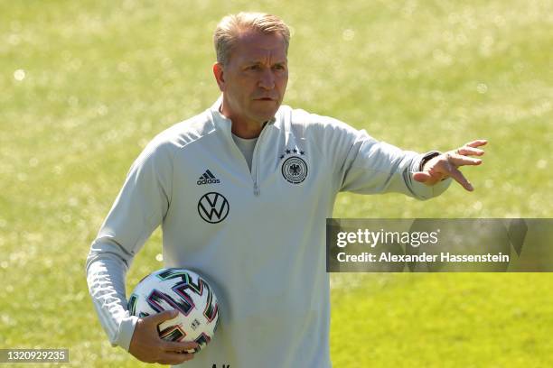 Andreas Köpcke, assistent coach of team Germany looks on during a training session of the German national team at training ground "Fußballplatz...