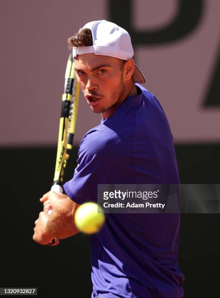 Maximilian Marterer of Germany plays a backhand in their mens singles first round match against Filip Krajinovic of Serbia on day two of the 2021...