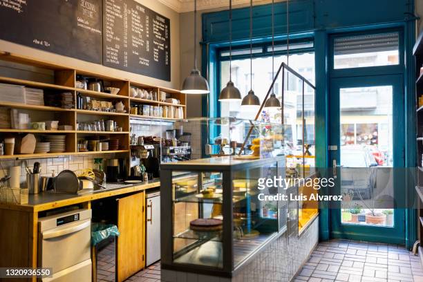 interior of a small coffee shop - boulangerie vitrine stockfoto's en -beelden