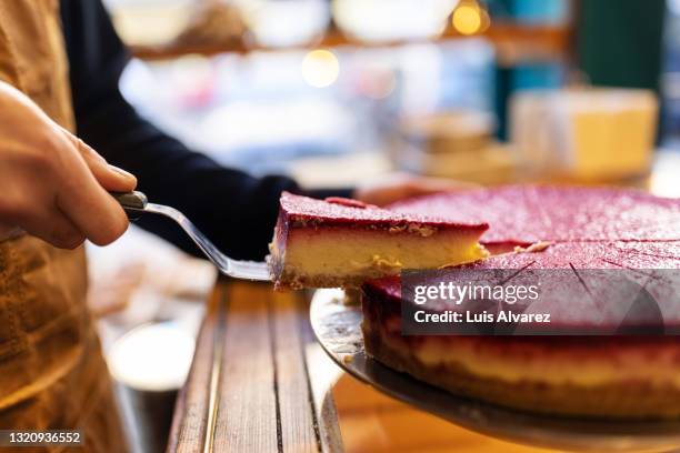 waiter serving slice of cake at cafe - cake slices stock pictures, royalty-free photos & images