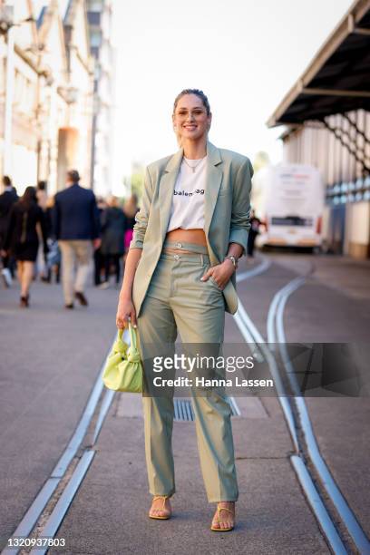 Nikki Phillips wearing Balenciaga white t-shirt, ASOS suit and Bottega Veneta bag at Afterpay Australian Fashion Week 2021 on May 31, 2021 in Sydney,...
