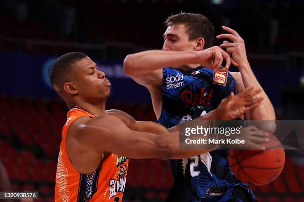 Scott Machado of the Taipans wins the turn over off Mason Peatling of Melbourne United during the round 20 NBL match between Melbourne United and...