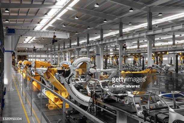 automated car manufacturing plant - robot and car factory stock pictures, royalty-free photos & images