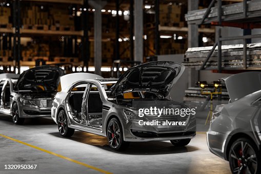 Cars on assembly line in plant Cars on assembly line in plant