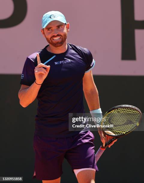 Bjorn Fratangelo of The United States reacts in their mens singles first round match against Cameron Norrie of Great Britain on day two of the 2021...