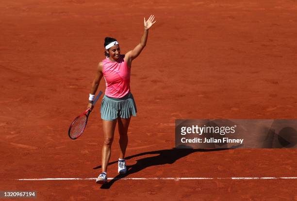Caroline Garcia of France celebrates victory in their ladies singles first round match against Laura Siegemund of Germany on day two of the 2021...