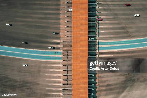 directly above view of a highway toll in spain with contactless payment lanes. - peaje fotografías e imágenes de stock