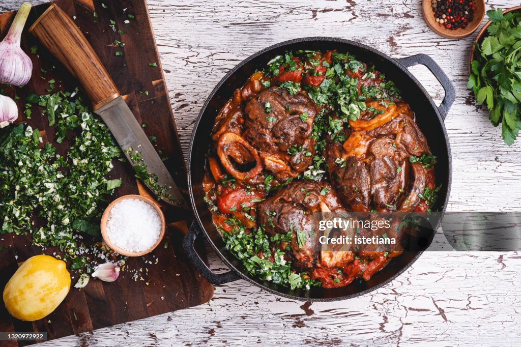 Braised veal shank dish osso buco and gremolata green sauce