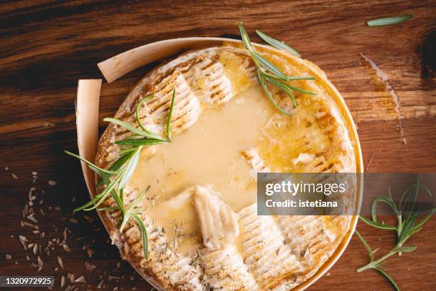 baked camembert with herbs, close up - camambert bildbanksfoton och bilder