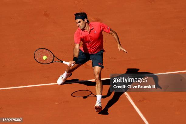 Roger Federer of Switzerland plays a forehand in their mens singles first round match against Denis Istomin of Uzbekistan on day two of the 2021...