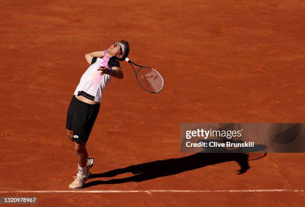 Denis Istomin of Uzbekistan serves in their ladies singles first round match against Roger Federer of Switzerland on day two of the 2021 French Open...