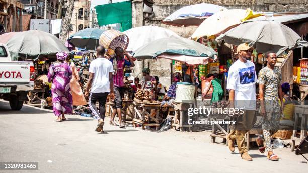 street market - lagos, nigeria - nigeria market stock pictures, royalty-free photos & images