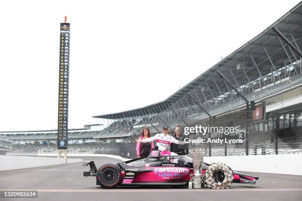 Helio Castroneves poses doing a portrait session at the finish line a day after winning the Indianapolis 500 at Indianapolis Motor Speedway on May...