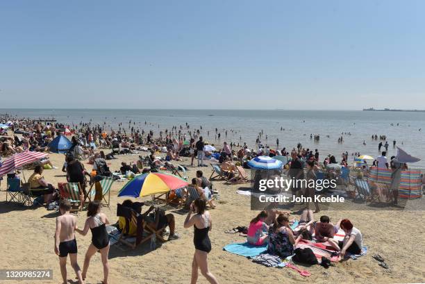 Crowds gather to enjoy the warm sunny weather on Jubilee beach on May 31, 2021 in Southend, England. Today's bank holiday Monday brings highs of 77F...