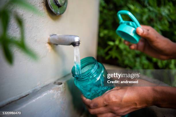 fill water bottle - women with health faucet stock pictures, royalty-free photos & images