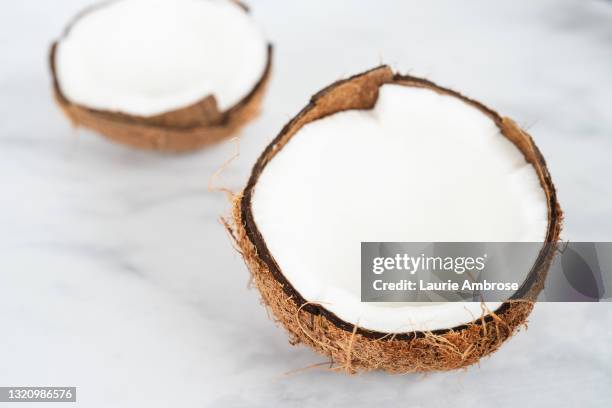 coconut cracked open - half open stock pictures, royalty-free photos & images