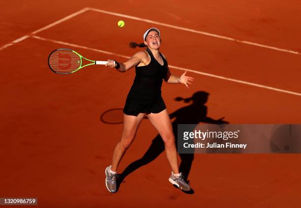 Jelena Ostapenko of Latvia plays a forehand in their ladies singles first round match against Sofia Kenin of The United States on day two of the 2021...