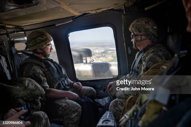 Coalition soldiers fly to Baghdad International Airport from the International Zone in a U.S. Blackhawk helicopter on May 31, 2021 in Baghdad, Iraq....