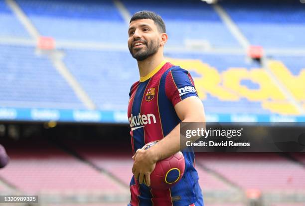 Sergio Aguero smiles as he is presented as a Barcelona player at the Camp Nou Stadium on May 31, 2021 in Barcelona, Spain.