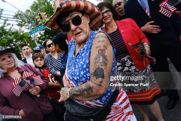 People watch the annual Memorial Day Parade on May 31, 2021 in the Staten Island borough of New York City. Dozens of cars, veterans, local...