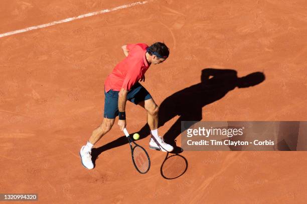May 31. Roger Federer of Switzerland plays a shot between his legs during his match against Denis Istomin of Uzbekistan on Court Philippe-Chatrier...