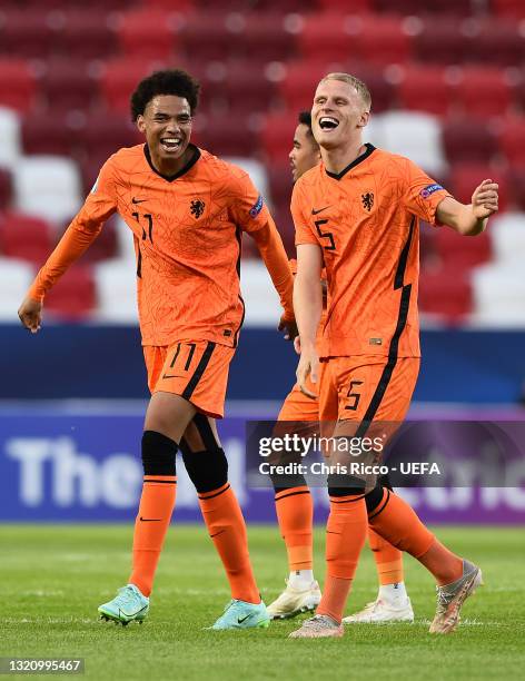 Calvin Stengs and Mitchel Bakker of Netherlands celebrates their side's victory after the 2021 UEFA European Under-21 Championship Quarter-finals...