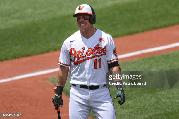 Pat Valaika of the Baltimore Orioles reacts after striking out looking against the Minnesota Twins during the third inning at Oriole Park at Camden...