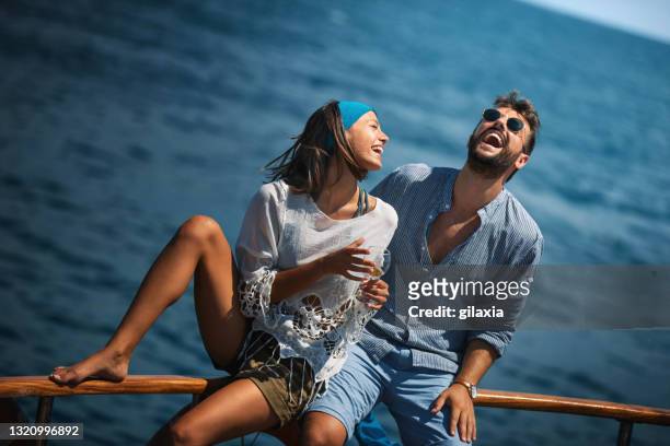 young couple on a sailing cruise. - couple on cruise ship stock pictures, royalty-free photos & images