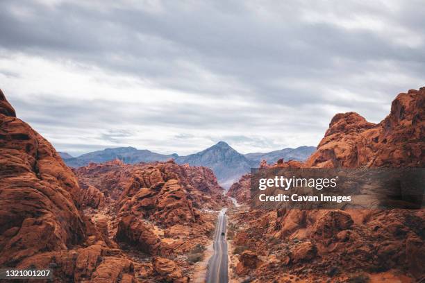 a road in valley of fire state park - nevada road stock pictures, royalty-free photos & images