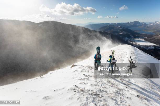 skiers looking at the snow powder formed by the wind - molise stock-fotos und bilder