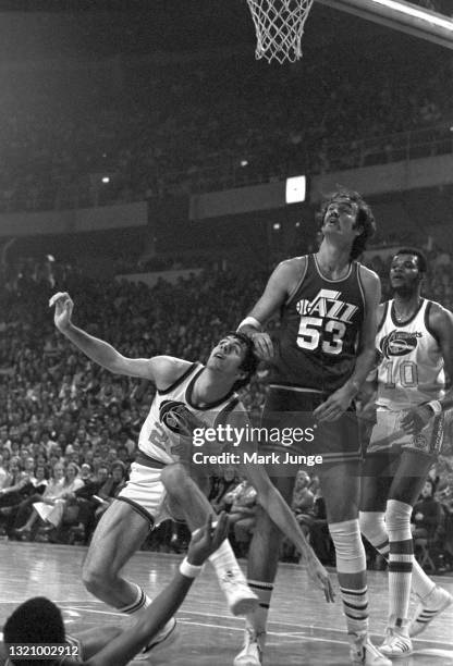 New Orleans Jazz center Rich Kelley pushes Denver Nuggets forward Bobby Jones to the floor during an NBA game at McNichols Arena on January 12, 1977...