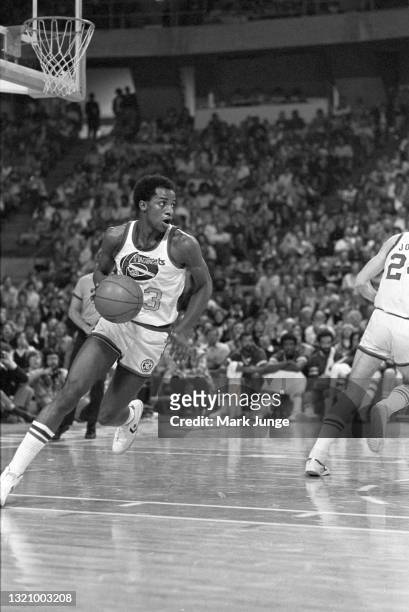 Denver Nuggets forward David Thompson pivots to dribble upcourt during an NBA basketball game against the New Orleans Jazz at McNichols Arena on...
