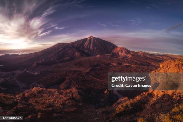 famous volcano of canary islands at sunset - pico de teide stock-fotos und bilder