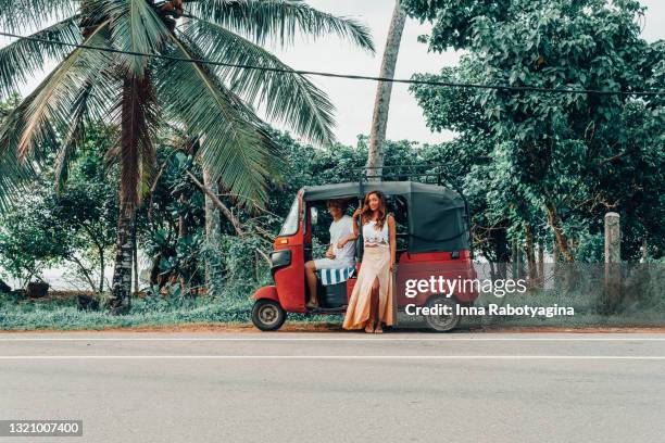fun couple road trip on tuk tuk in sri lanka - ahangama stock pictures, royalty-free photos & images