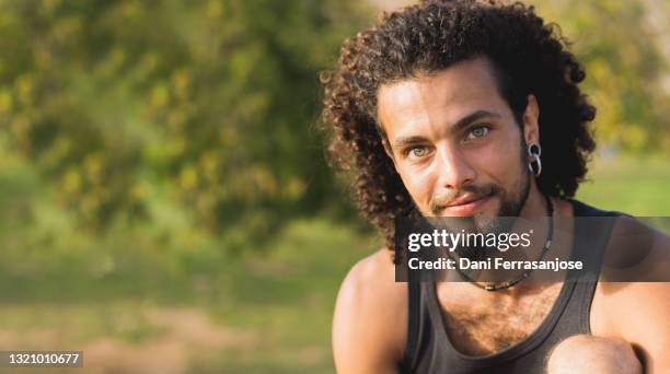 portrait of latin boy with blue eyes, copy space - latin beauty stockfoto's en -beelden