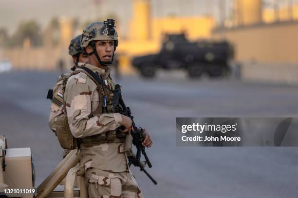 Iraqi Army soldiers stand guard on a road between the U.S. Embassy and the International Zone on May 30, 2021 in Baghdad, Iraq. Coalition forces...