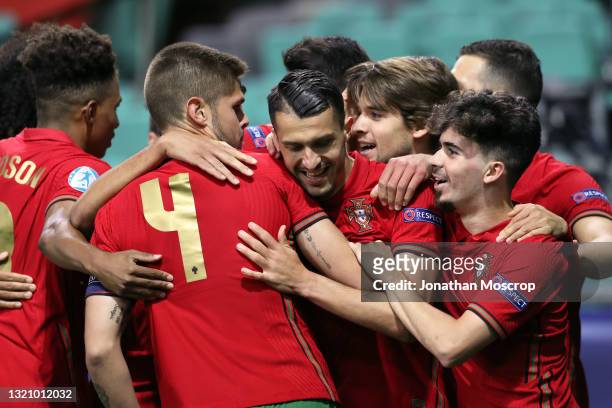 Dany Mota of Portugal celebrates with team mates after scoring to give the side a 1-0 lead during the 2021 UEFA European Under-21 Championship...