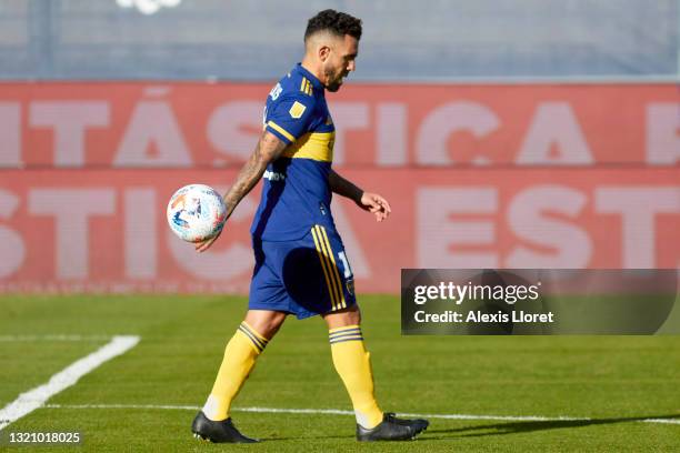 Carlos Tevez of Boca Juniors looks dejected after his team was defeated in the penalty shoot-out during a semifinal match of Copa de la Liga...