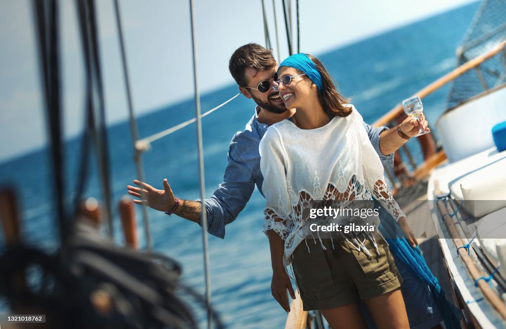 Young couple on a sailing cruise.