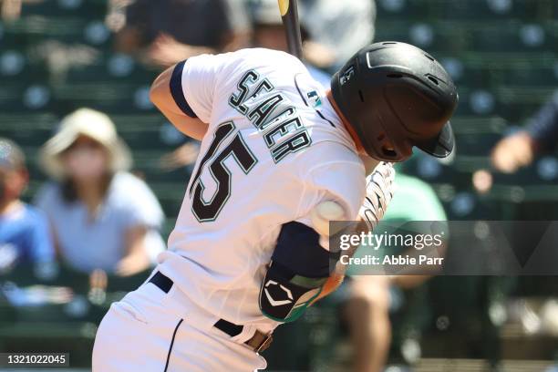 Kyle Seager of the Seattle Mariners is hit by a pitch during the third inning against the Oakland Athletics at T-Mobile Park on May 31, 2021 in...