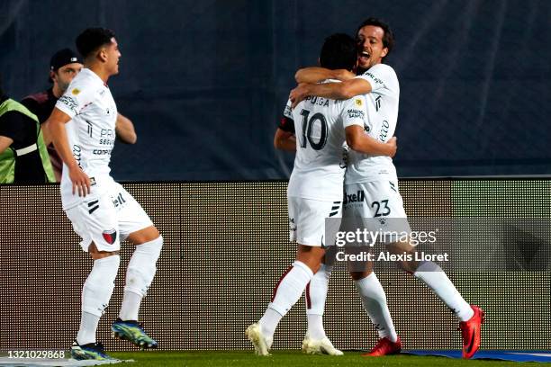 Luis Miguel Rodríguez of Colon celebrates with teammate Cristian Bernardi after scoring the first goal of his team during a semifinal match of Copa...