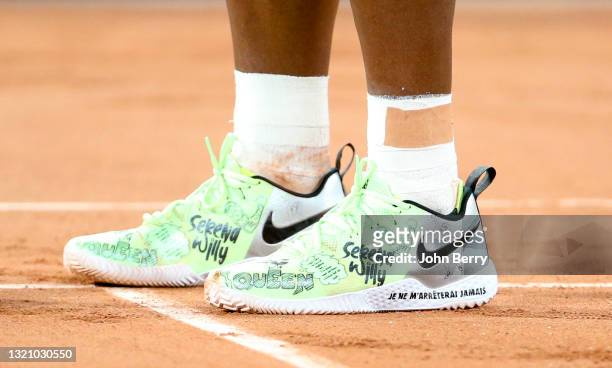 Nike shoes of Serena Williams of USA with two slogans printed on them: 'Je ne m'arreterai jamais' meaning 'I'll never stop', and another one in...