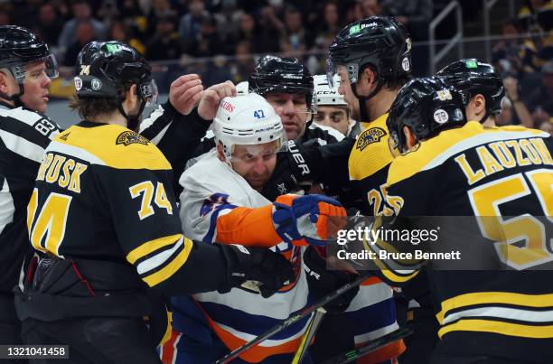 Leo Komarov of the New York Islanders fends off the Boston Bruins during the second period in Game Two of the Second Round of the 2021 Stanley Cup...