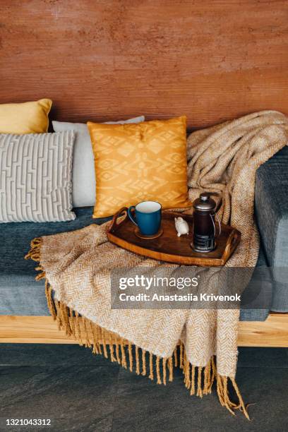 serving tray with tea on gray sofa. - decorating photos et images de collection