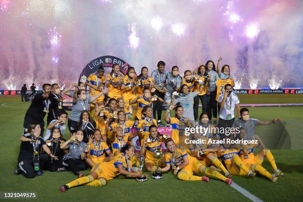 Players of Tigres celebrate with the trophy after winning the Final second leg match between Tigres UANL and Chivas as part of the Torneo Guard1anes...