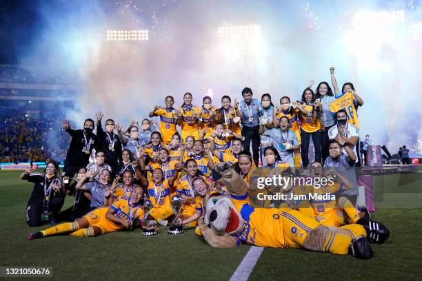 Players of Tigres celebrate with the champion trophy after winning the Final second leg match between Tigres UANL and Chivas as part of the Torneo...